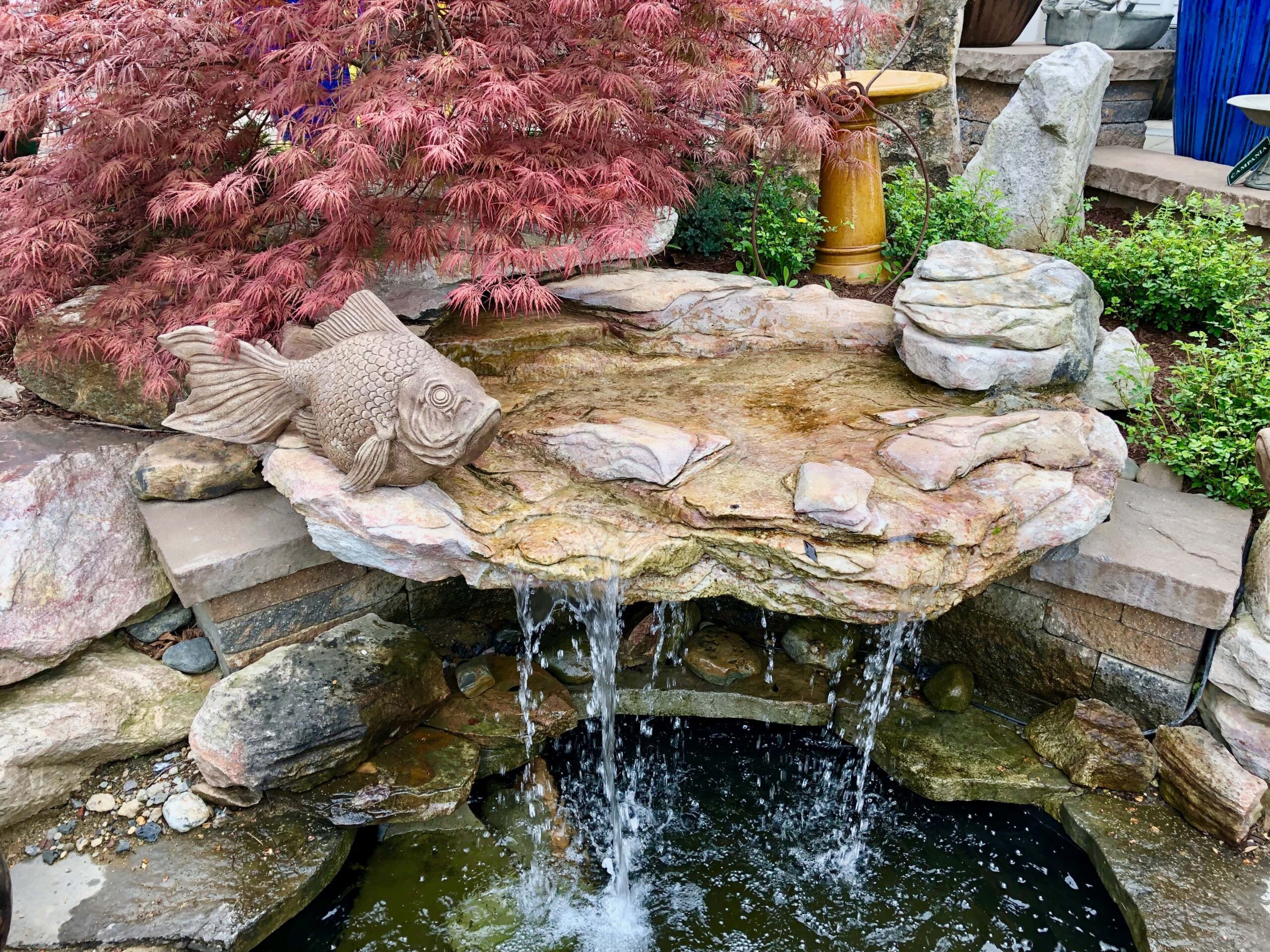 Landscaped backyard water feature with integrated water features, providing a serene setting for outdoor design