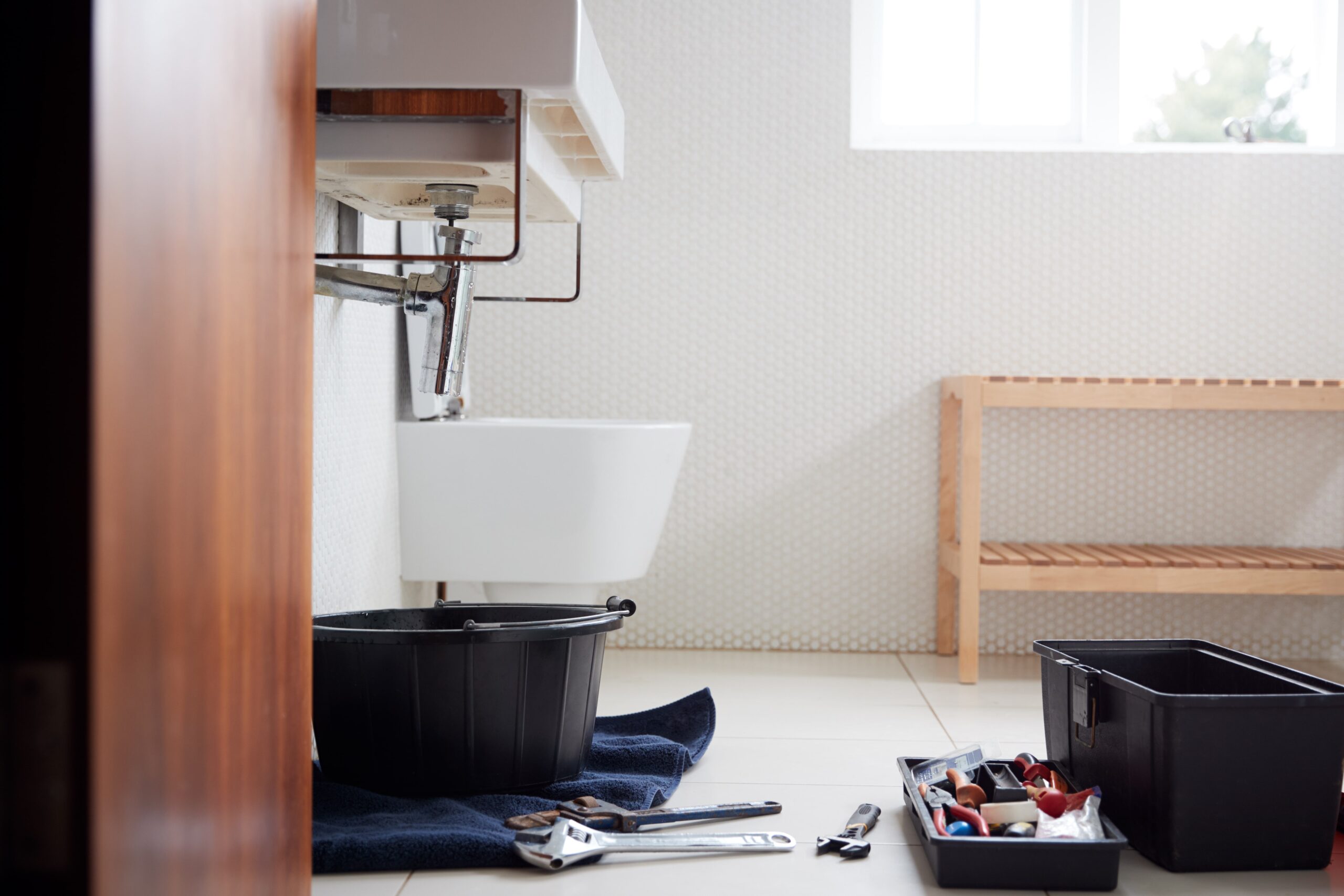 bathroom with plumbing tools on the ground